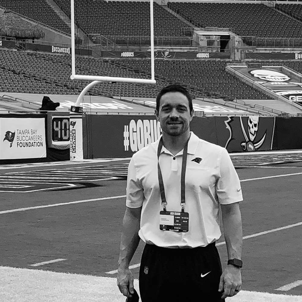 Dr. Nevin Markel in front of Tampa Bay Buccaneers' end zone